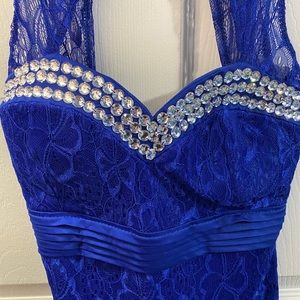 Royal blue mini dress with embellishments.